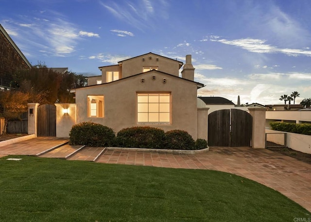 145 13th St, Del Mar, CA 92014 - mediterranean / spanish-style home with a gate, stucco siding, and a chimney