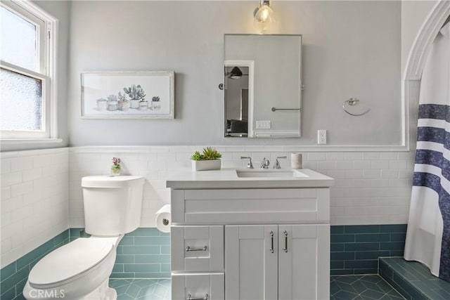 4368 Adams Ave, San Diego, CA 92116 - bathroom featuring tile walls, wainscoting, vanity, tile patterned flooring, and a shower with shower curtain