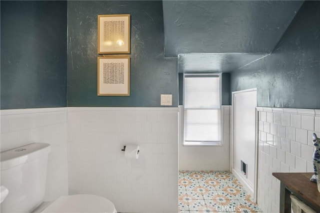 4368 Adams Ave, San Diego, CA 92116 - bathroom with tile walls, healthy amount of natural light, tile patterned floors, and wainscoting