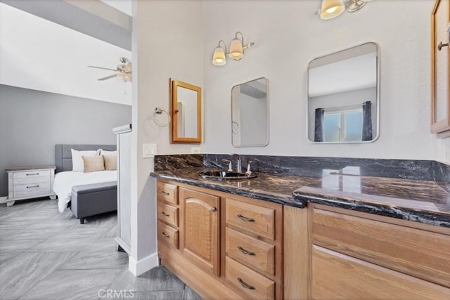 39878 Teal Dr, Murrieta, CA 92562 - ensuite bathroom with baseboards, a ceiling fan, vanity, and ensuite bathroom