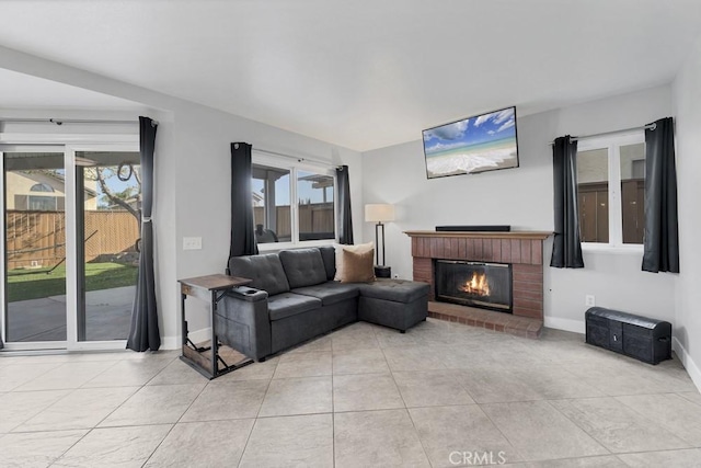 39878 Teal Dr, Murrieta, CA 92562 - living room with a brick fireplace, baseboards, and light tile patterned floors