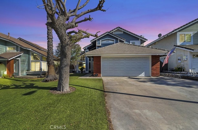 39878 Teal Dr, Murrieta, CA 92562 - traditional home featuring an attached garage, a tile roof, driveway, a lawn, and brick siding