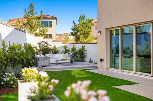 view of yard with a patio, fence, and an outdoor living space