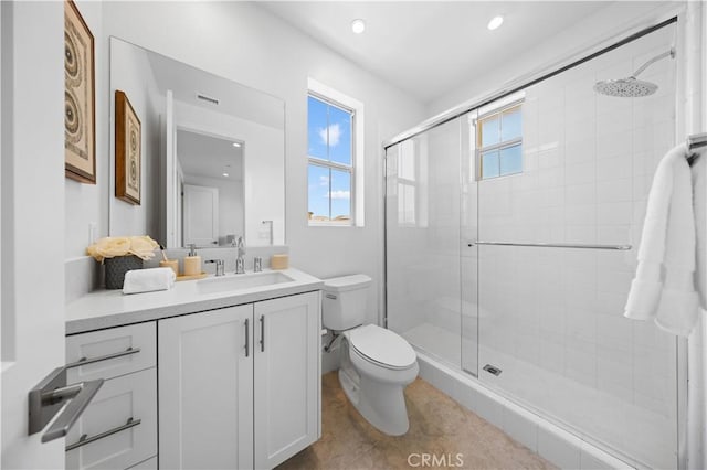 full bathroom with vanity, recessed lighting, a shower stall, and toilet