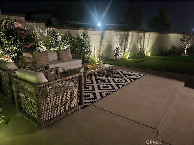 patio at night with an outdoor living space
