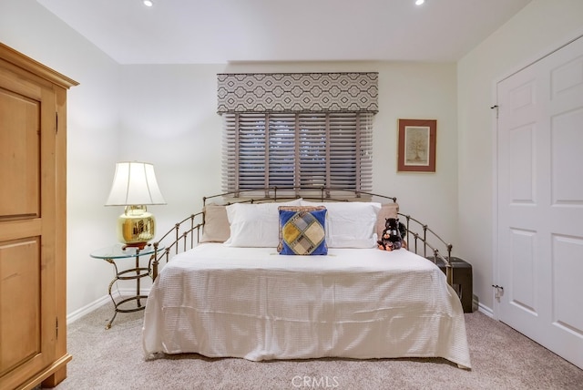bedroom with recessed lighting, baseboards, and carpet floors
