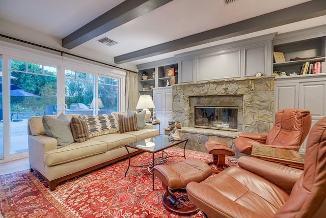 6217 Melba Ave, Woodland Hills, CA 91367 - living area featuring beam ceiling, a stone fireplace, wood finished floors, and built in features