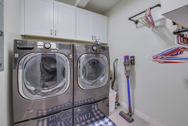 6217 Melba Ave, Woodland Hills, CA 91367 - laundry area featuring cabinet space, independent washer and dryer, baseboards, and light tile patterned flooring