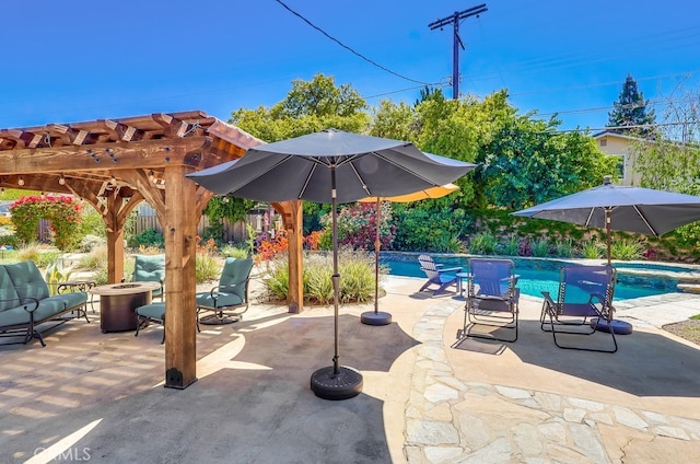 view of patio featuring an outdoor fire pit, a pergola, a pool with connected hot tub, and fence
