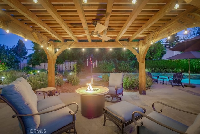 6217 Melba Ave, Woodland Hills, CA 91367 - patio at night with an outdoor fire pit, a patio, and ceiling fan