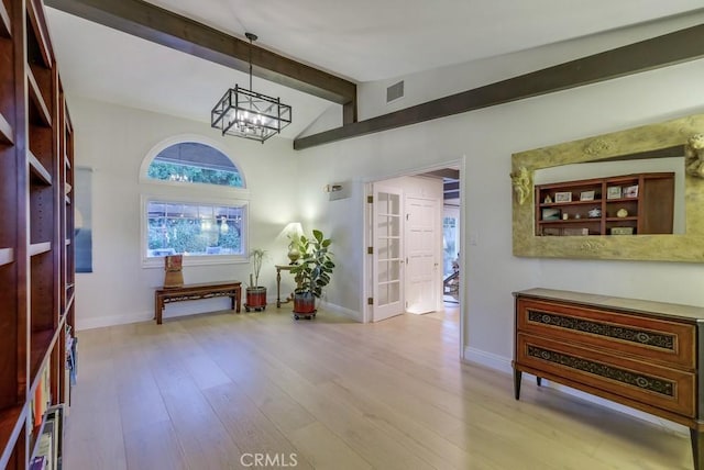 6217 Melba Ave, Woodland Hills, CA 91367 - entrance foyer featuring a chandelier, wood finished floors, and baseboards
