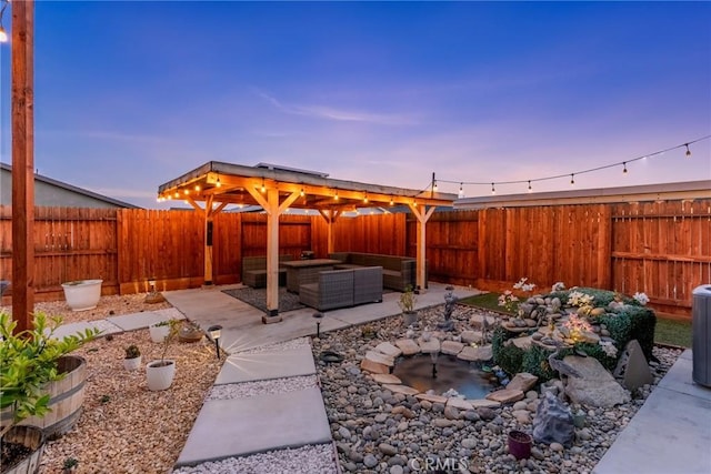 view of patio / terrace with an outdoor living space and a fenced backyard