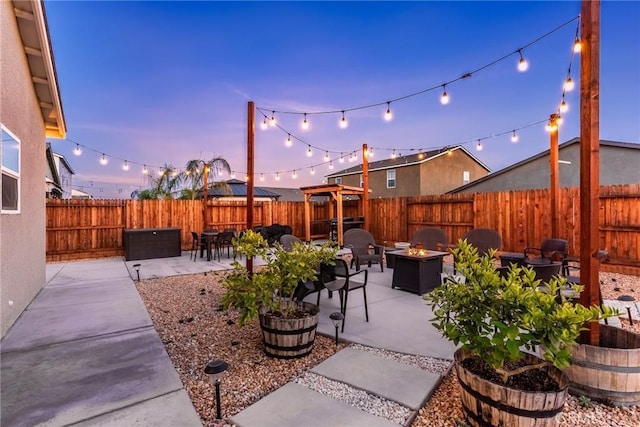 view of patio / terrace with a fenced backyard and an outdoor fire pit