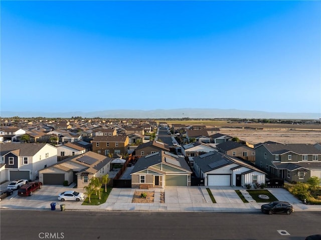birds eye view of property with a mountain view and a residential view