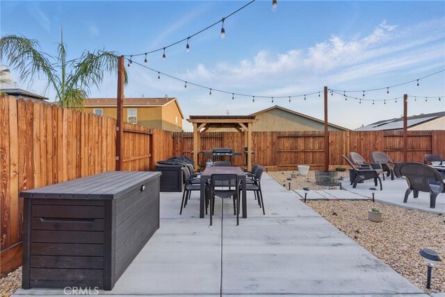 view of patio / terrace with a fenced backyard and outdoor dining area