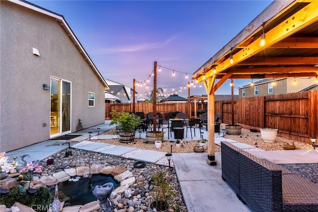 view of patio featuring a fire pit and a fenced backyard
