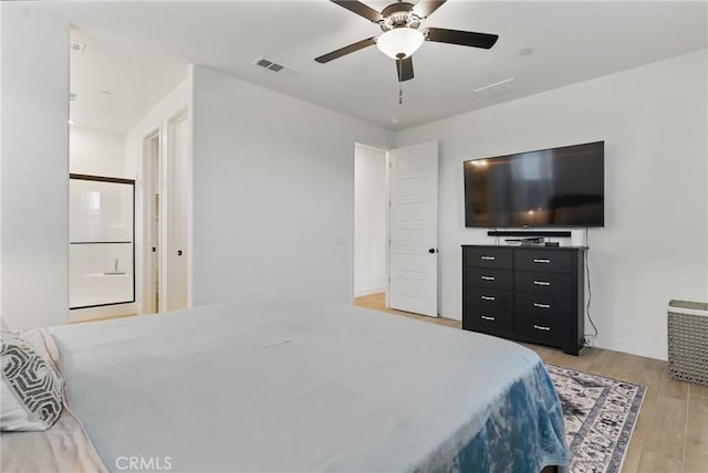 bedroom with visible vents, a ceiling fan, and light wood-style floors