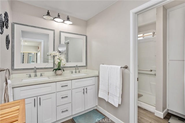 31725 Rancho Amigos Rd, Bonsall, CA 92003 - full bathroom with a sink, a walk in shower, and wood finished floors