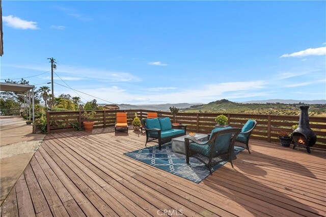 31725 Rancho Amigos Rd, Bonsall, CA 92003 - wooden terrace with a mountain view and an outdoor living space