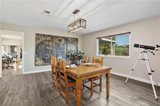 31725 Rancho Amigos Rd, Bonsall, CA 92003 - dining room featuring baseboards, wood finished floors, and visible vents