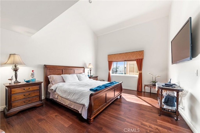 2408 Ocean Dr, Oxnard, CA 93035 - bedroom with baseboards, vaulted ceiling, and wood finished floors