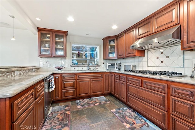 2408 Ocean Dr, Oxnard, CA 93035 - kitchen with a sink, appliances with stainless steel finishes, under cabinet range hood, backsplash, and stone finish flooring