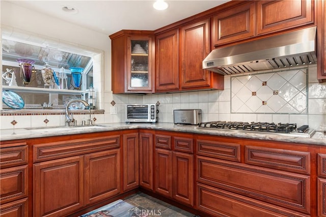 2408 Ocean Dr, Oxnard, CA 93035 - kitchen featuring a sink, backsplash, a toaster, and under cabinet range hood