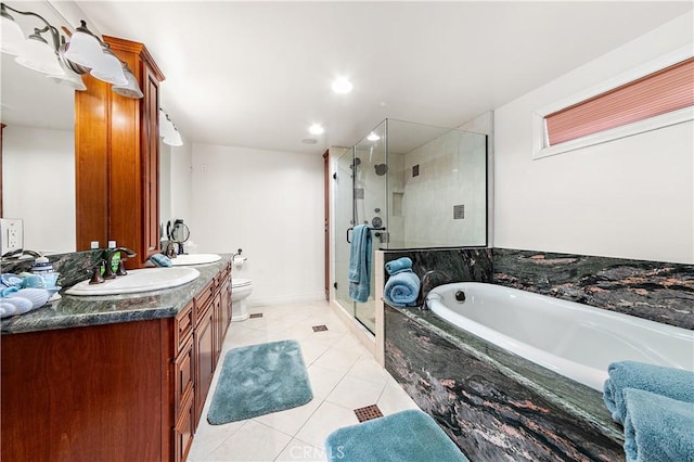2408 Ocean Dr, Oxnard, CA 93035 - full bathroom featuring a bath, vanity, tile patterned flooring, toilet, and a stall shower