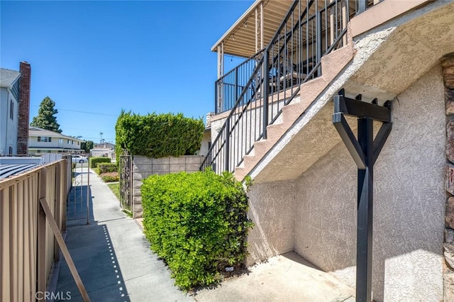 view of side of property featuring stucco siding