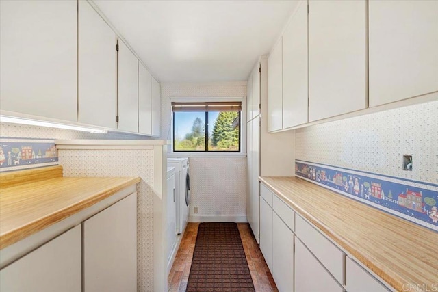 laundry room with washer and dryer and cabinet space