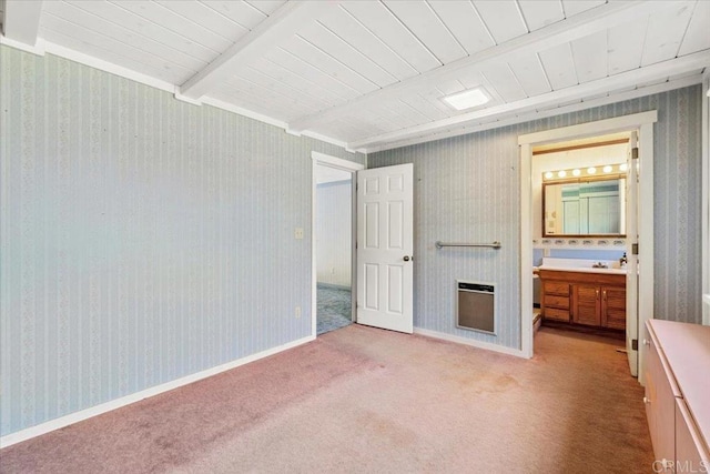unfurnished bedroom featuring beamed ceiling, wooden ceiling, heating unit, and light carpet