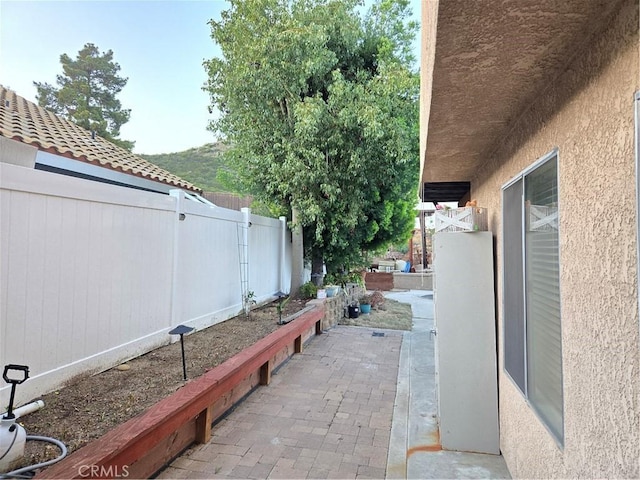 view of patio / terrace featuring fence