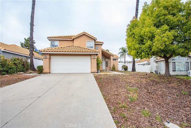 24356 Via Las Junitas, Murrieta, CA 92562 - view of front of property with driveway, a tile roof, fence, an attached garage, and stucco siding