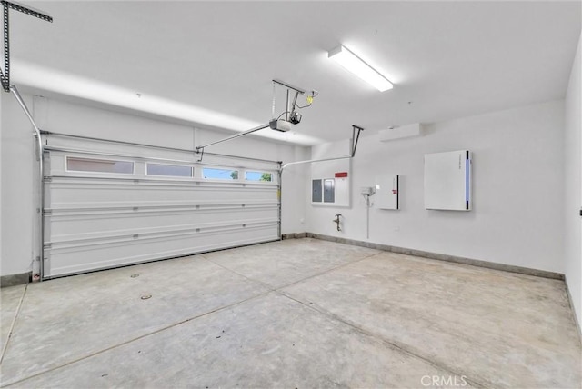 garage with a garage door opener, baseboards, and electric panel
