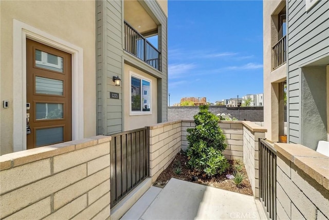 view of property exterior with a fenced front yard and stucco siding