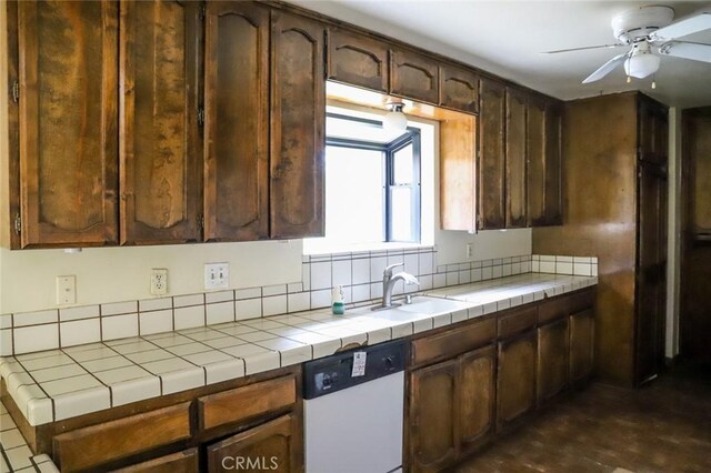 32157 Navajo Ct, Coarsegold, CA 93614 - kitchen with a sink, ceiling fan, tile countertops, and dishwasher