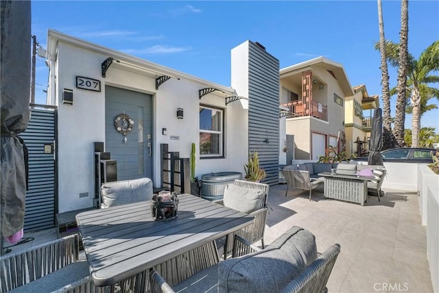 view of patio featuring outdoor lounge area and outdoor dining area