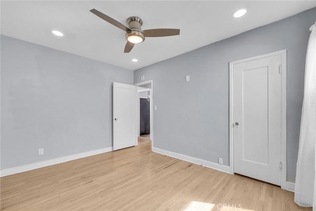 unfurnished bedroom with light wood-type flooring, ceiling fan, baseboards, and recessed lighting
