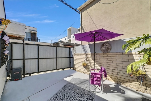 view of patio featuring fence