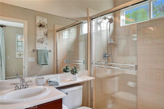 full bath featuring a shower stall and a wealth of natural light