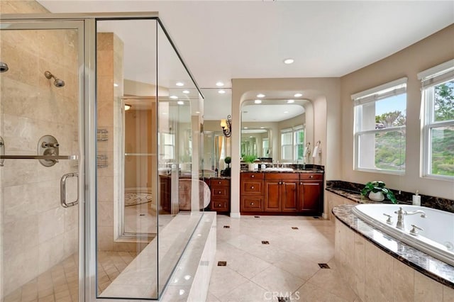 bathroom featuring a shower stall, tile patterned floors, a bath, vanity, and recessed lighting