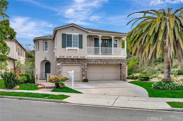 mediterranean / spanish-style house with stucco siding, concrete driveway, and a garage