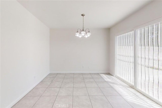 830 E Darlan St, Compton, CA 90220 - empty room with a chandelier, baseboards, and light tile patterned flooring