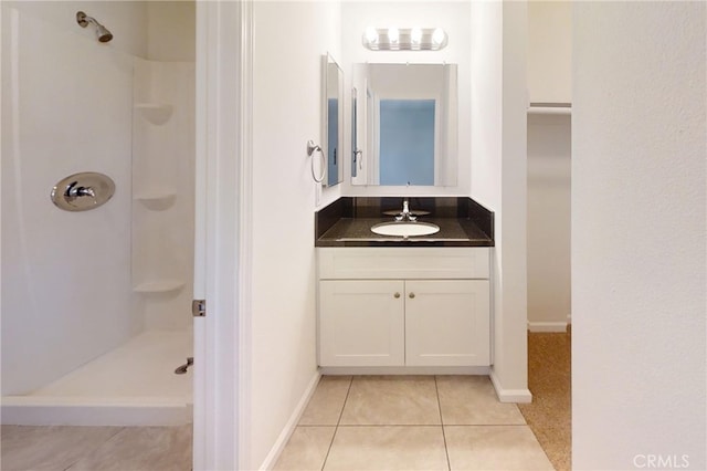 830 E Darlan St, Compton, CA 90220 - full bath with baseboards, vanity, tile patterned floors, and a shower