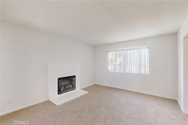 830 E Darlan St, Compton, CA 90220 - unfurnished living room with baseboards, carpet flooring, and a fireplace