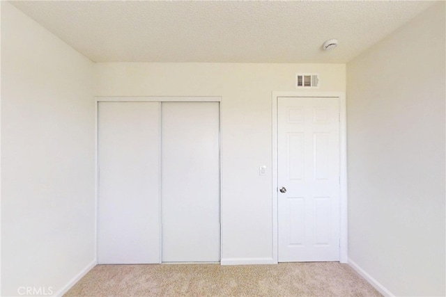 830 E Darlan St, Compton, CA 90220 - unfurnished bedroom featuring baseboards, light carpet, visible vents, and a closet