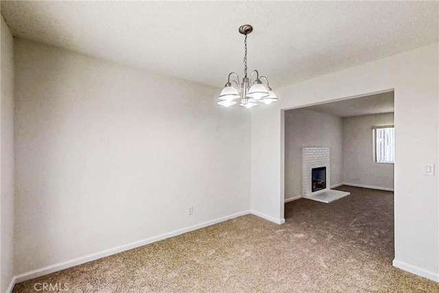 830 E Darlan St, Compton, CA 90220 - unfurnished living room featuring baseboards, carpet flooring, a fireplace, and a chandelier
