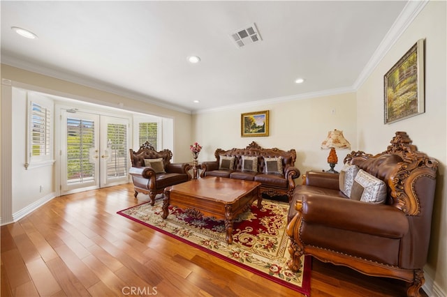 living area featuring crown molding, wood finished floors, french doors, recessed lighting, and baseboards