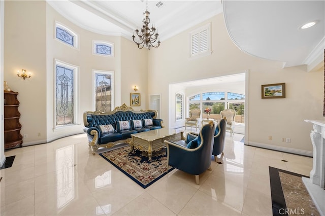 living area with crown molding, baseboards, a towering ceiling, a chandelier, and light tile patterned flooring