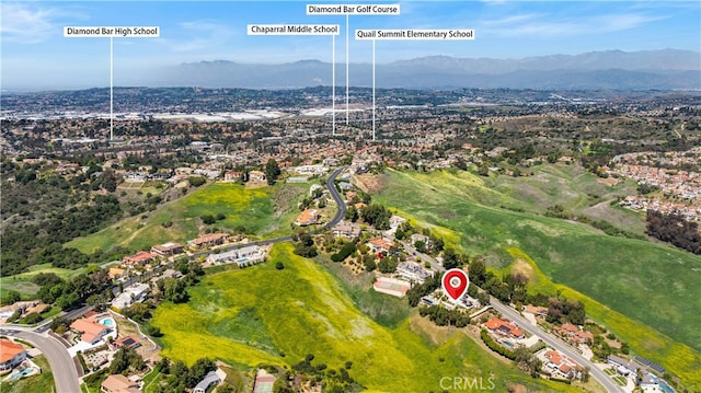 aerial overview of property's location featuring mountains